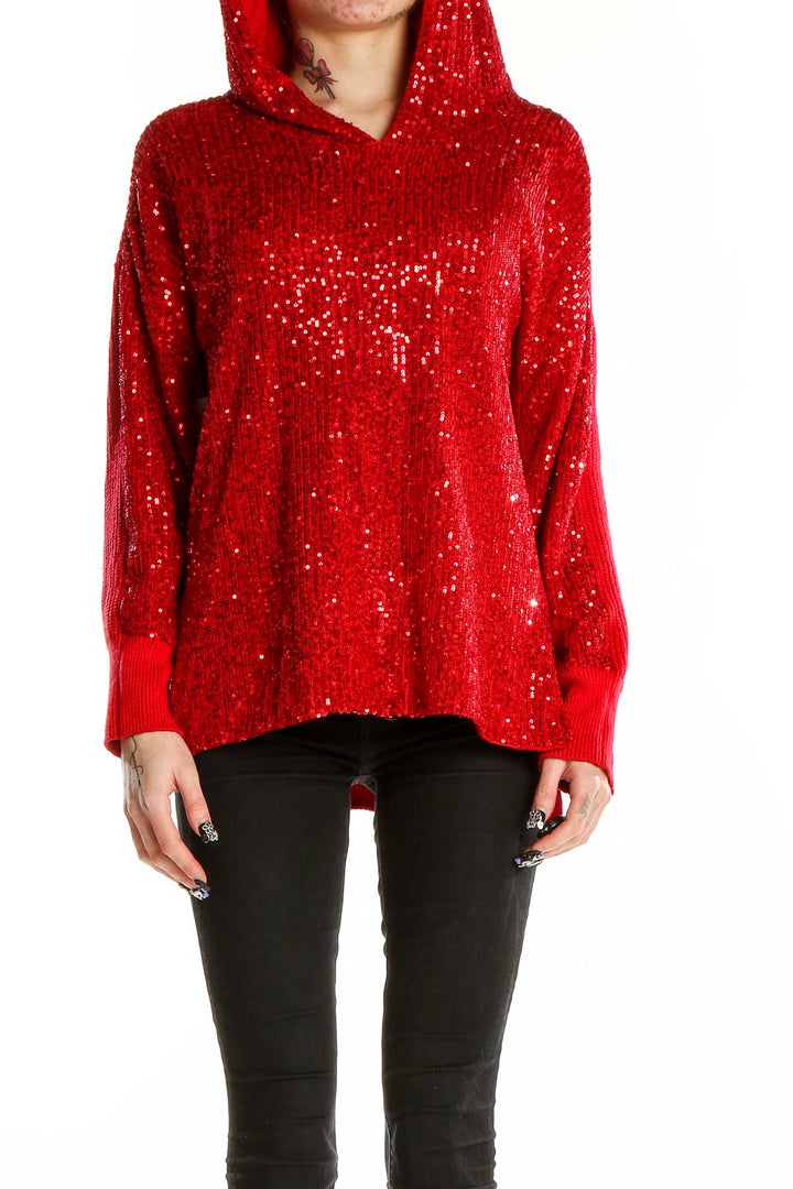 Front view of red sequined hooded sweater with all-over sparkle