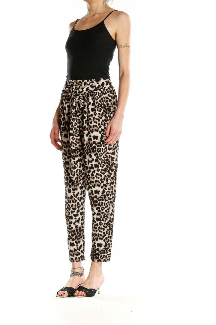 Front view of Entro leopard print tapered pants with tie-front detail