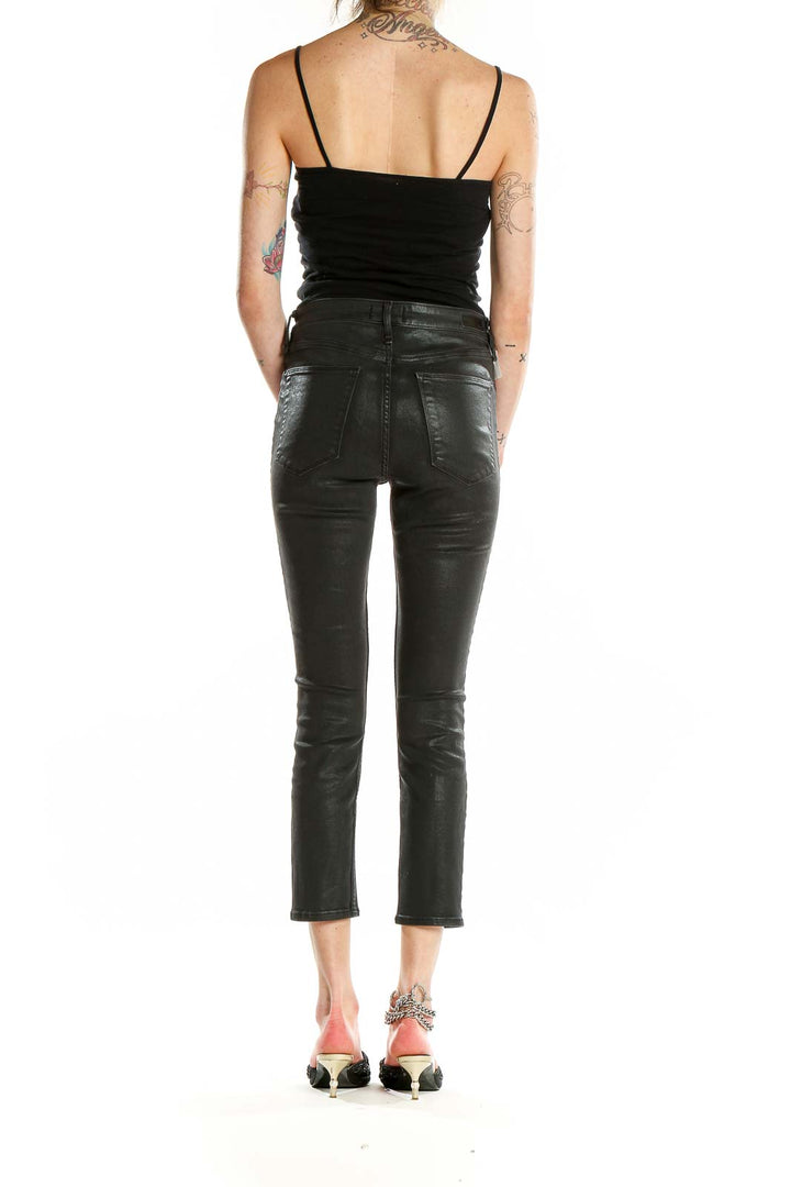 Back view of Abercrombie & Fitch black coated cropped skinny pants on model