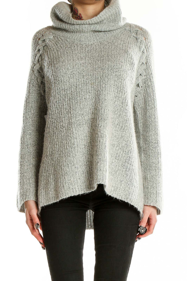 Front view of gray cowl neck sweater with lace-up shoulder details