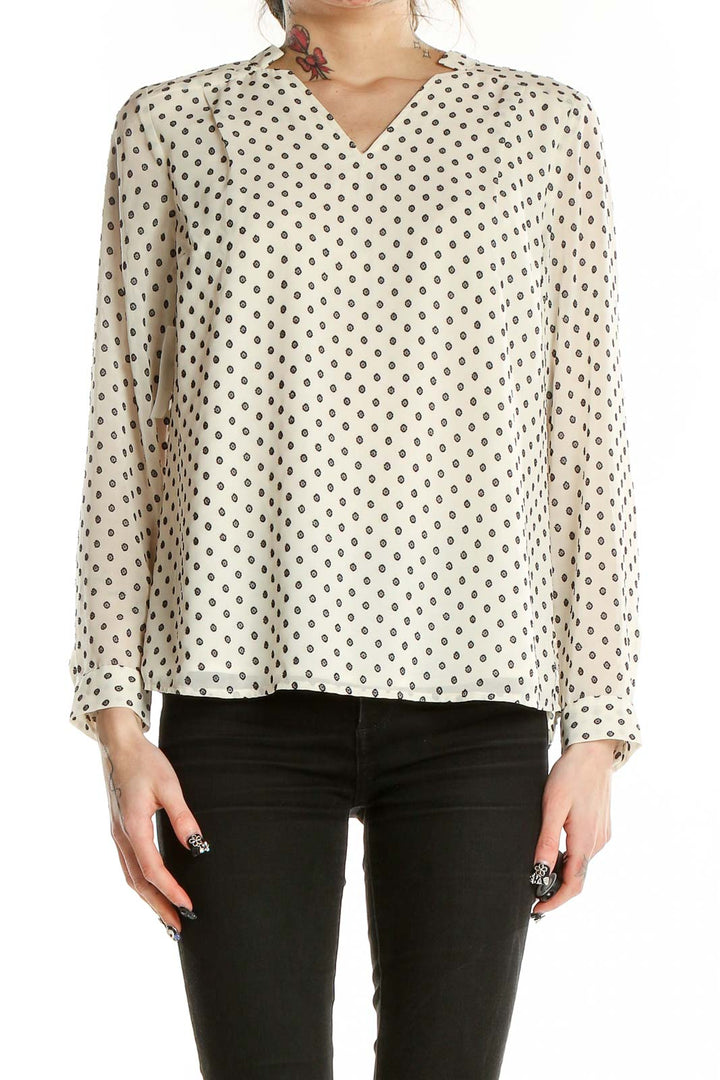 Front view of Talbots cream polka dot long sleeve blouse with V-neck