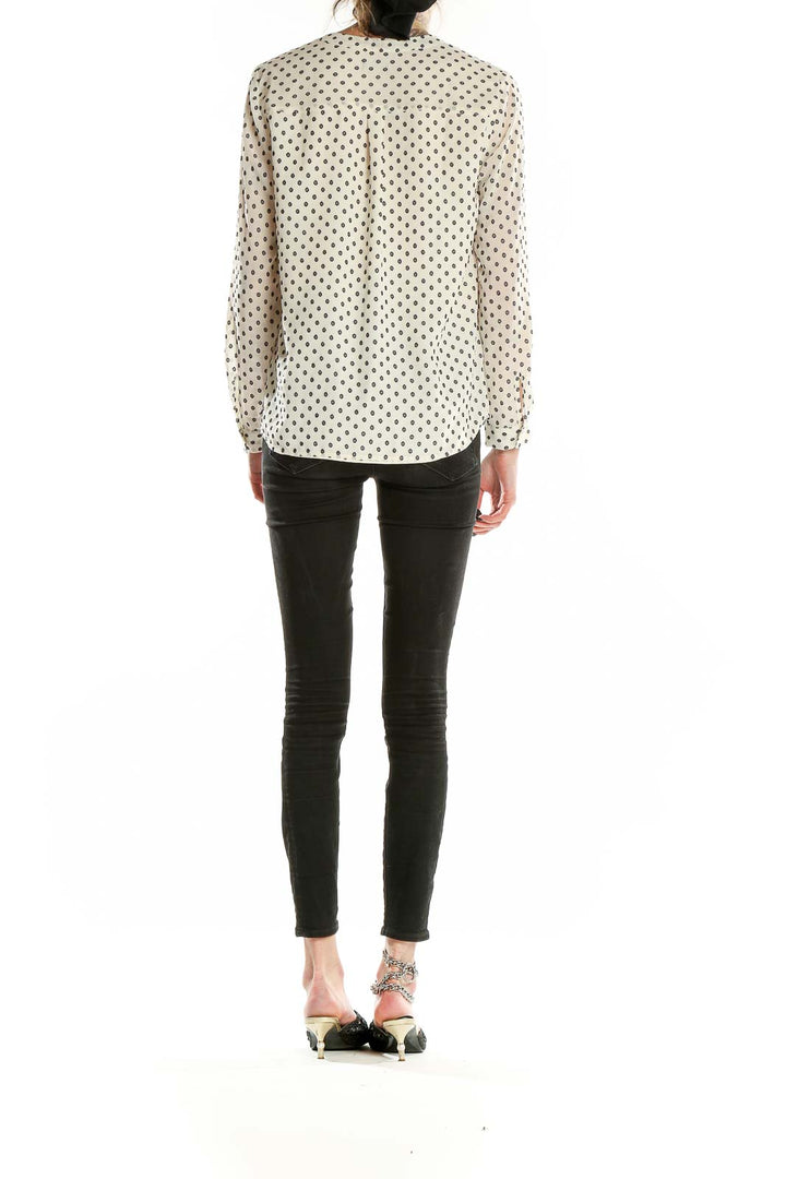 Back view of Talbots cream polka dot long sleeve blouse showing relaxed fit