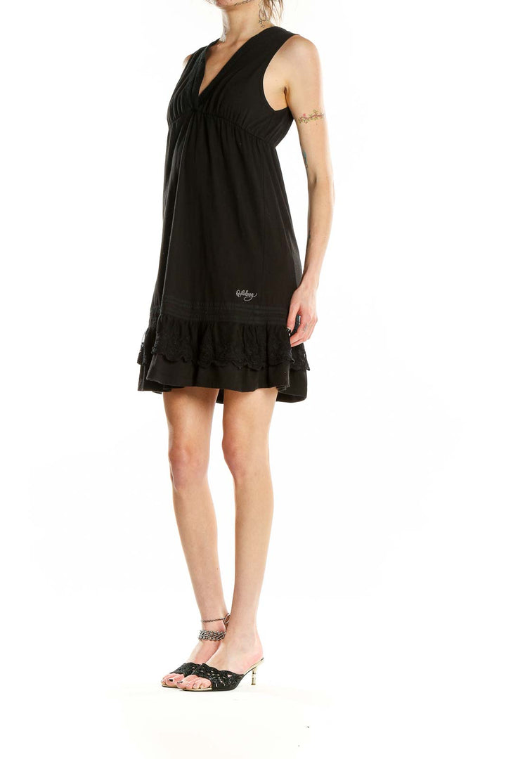 Front view of Billabong black sleeveless V-neck dress with ruffle hem