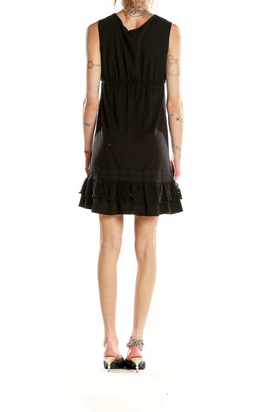 Back view of Billabong black sleeveless dress showing empire waist and ruffle hem