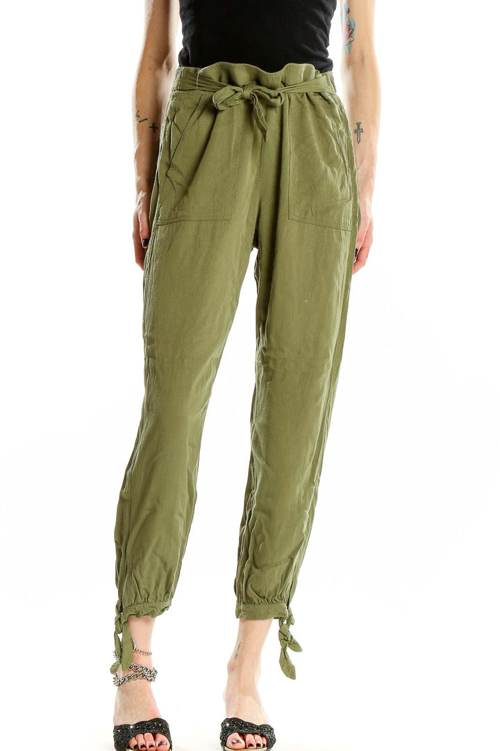 Front view of Rag Poets olive green drawstring pants with ankle ties