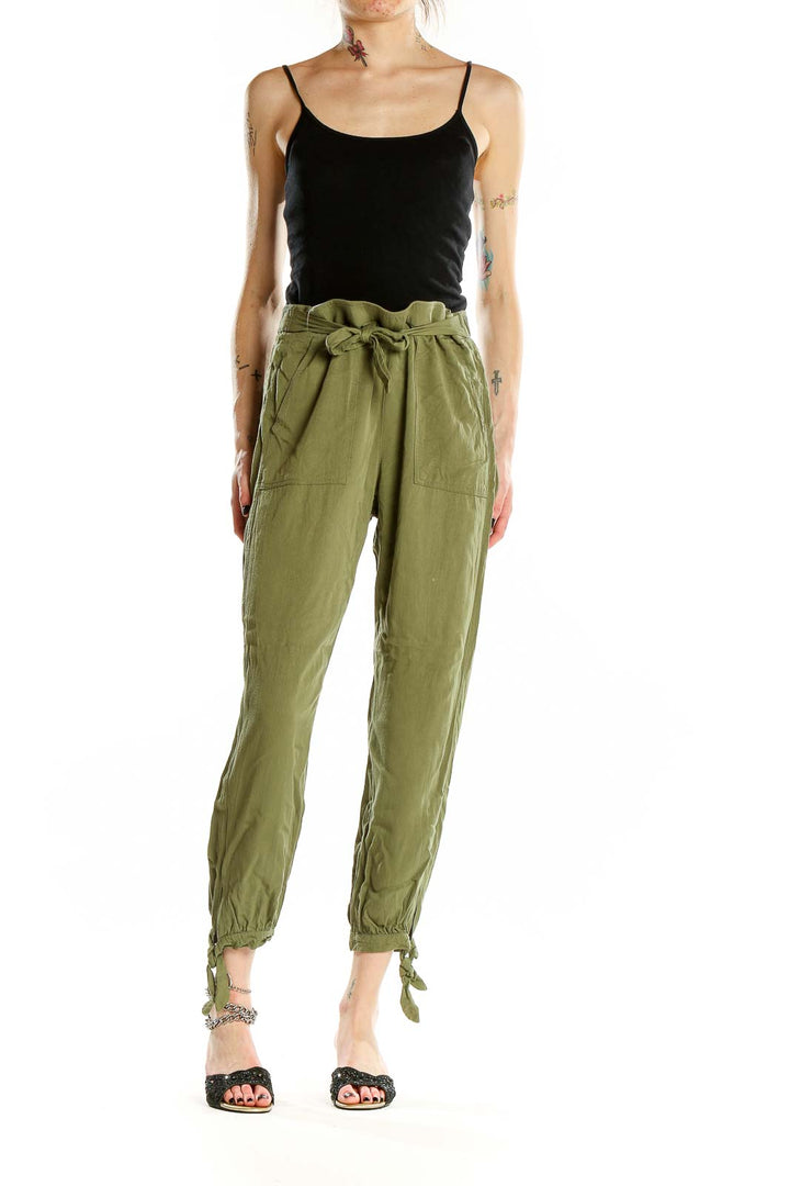 Front view of Rag Poets olive green drawstring pants with ankle ties