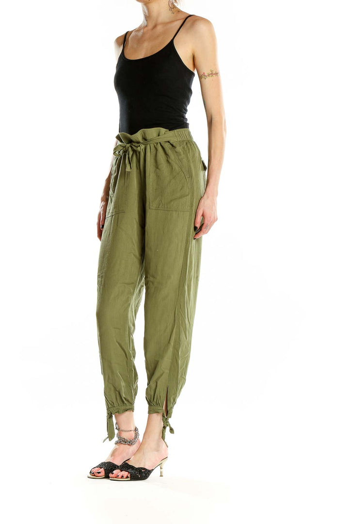 Front view of Rag Poets olive green drawstring pants with ankle ties