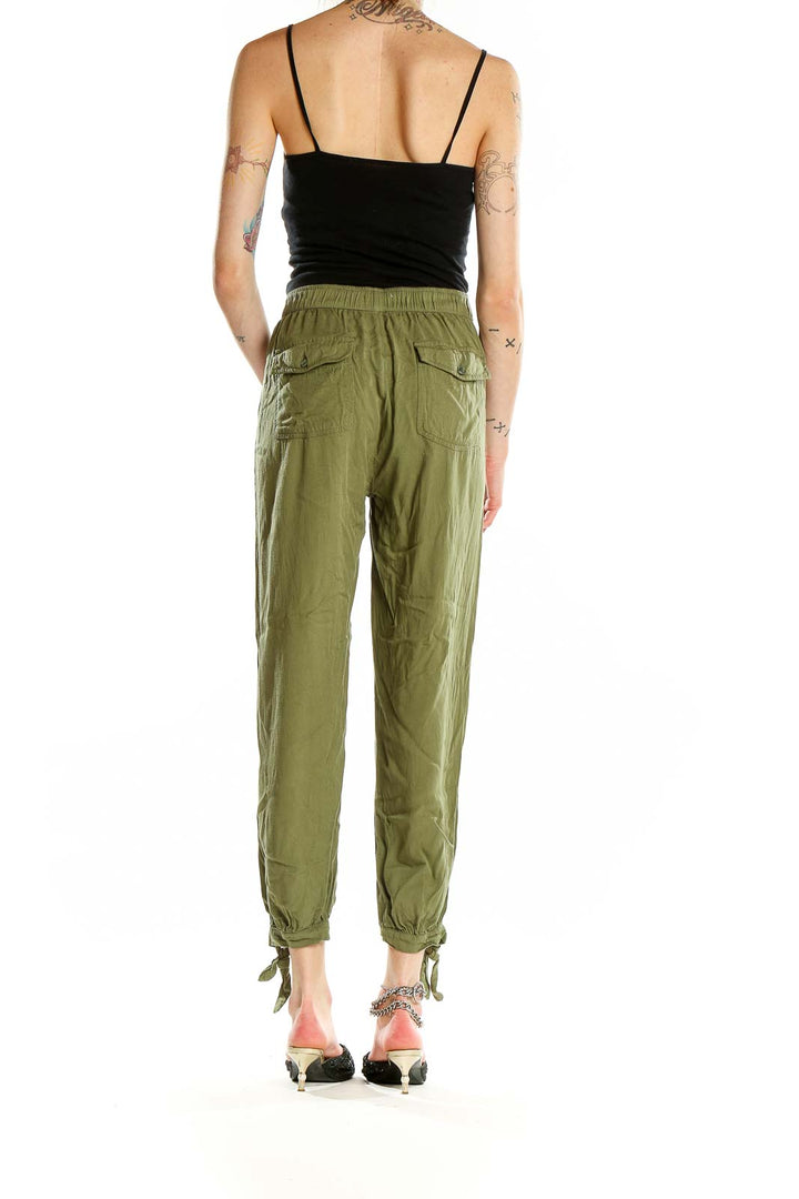 Back view of Rag Poets olive green pants showing relaxed fit and back pockets