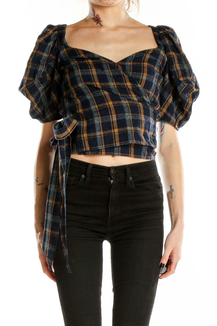 Front view of Madewell navy plaid puff-sleeve wrap top with sweetheart neckline