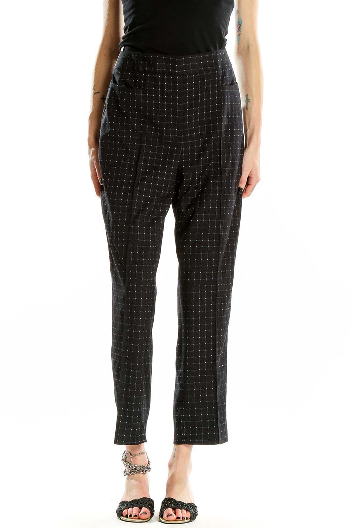 Front view of DKNY black high-waist pants with dotted pattern