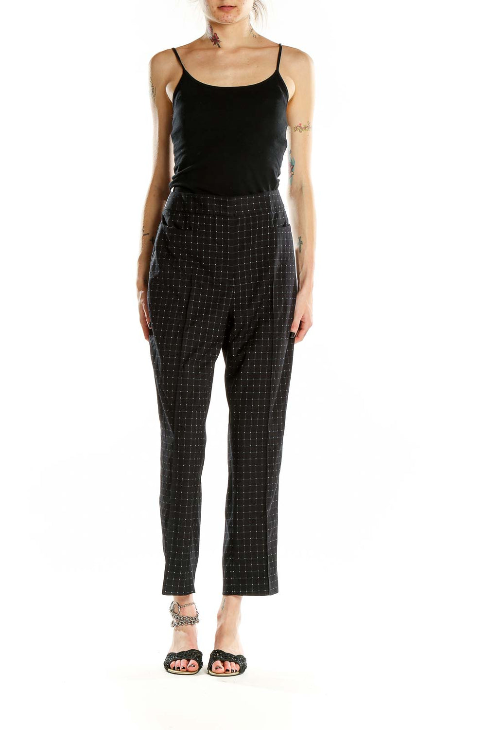 Front view of DKNY black high-waist pants with dotted pattern