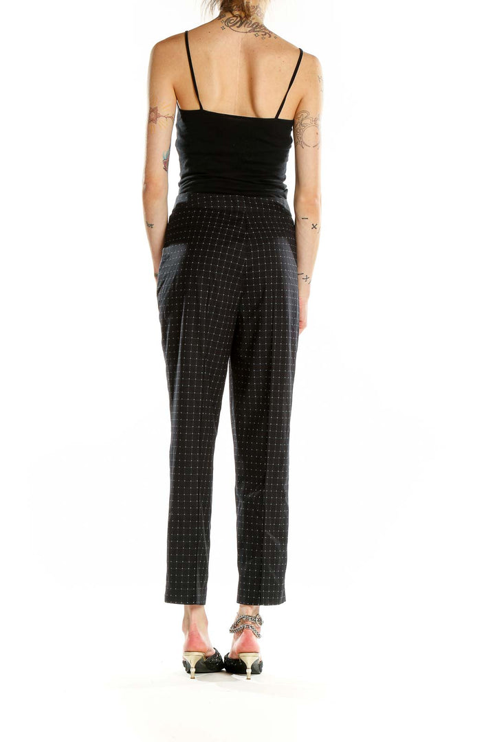 Back view of DKNY black high-waist pants showing tailored fit