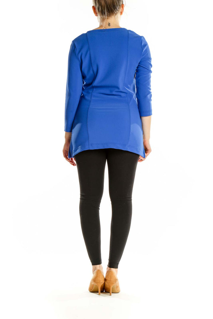 Back view of blue Boston Proper long sleeve top on model