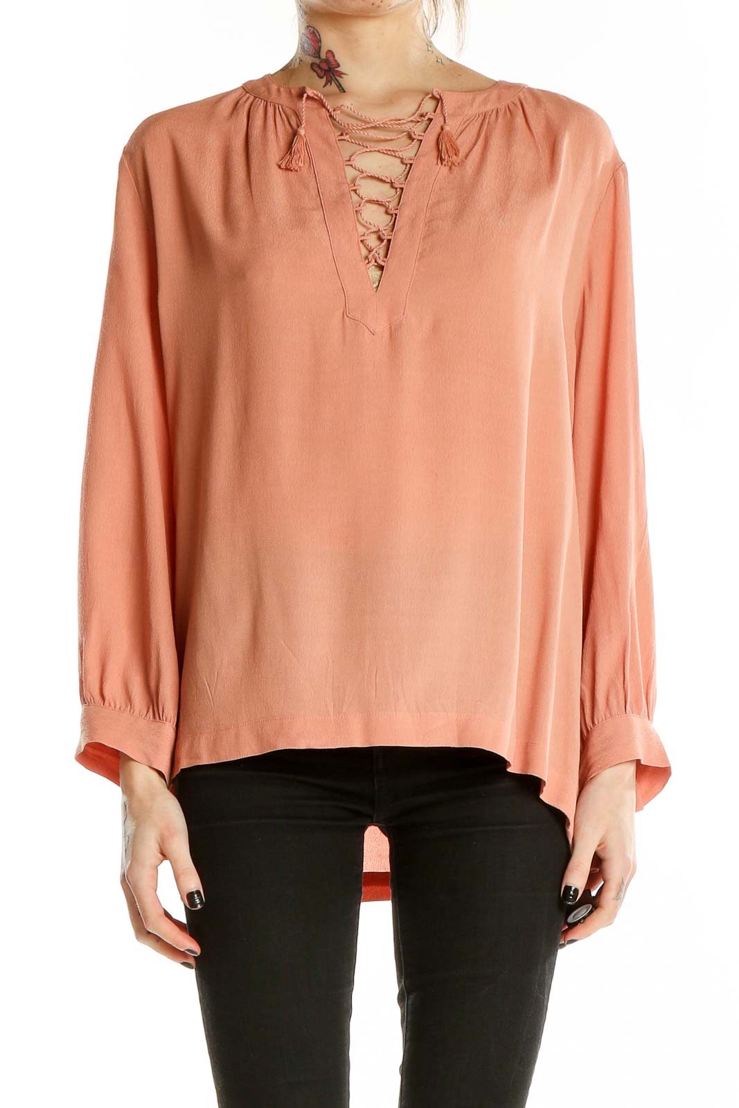 Front view of Madewell peach lace-up V-neck blouse