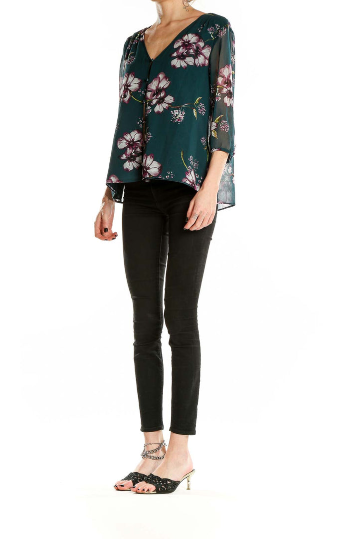 Front view of Cupcakes and Cashmere green floral V-neck blouse with 3/4 sleeves