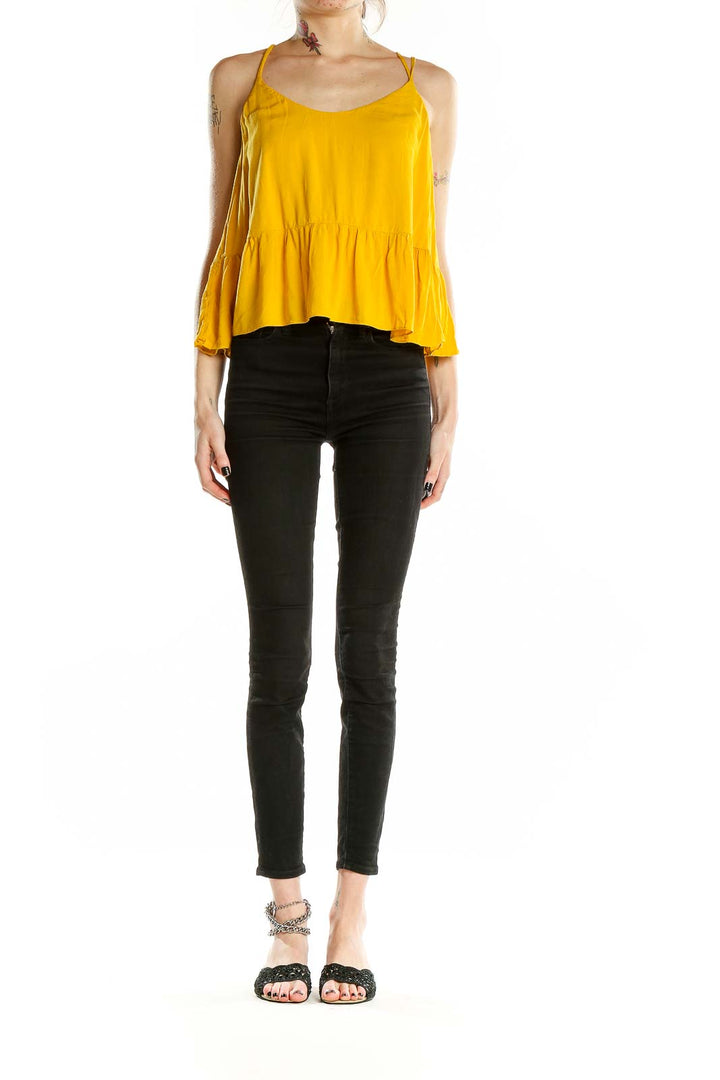 Front view of yellow Topshop camisole top with peplum hem