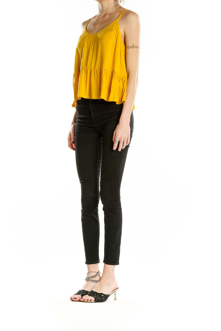 Front view of yellow Topshop camisole top with peplum hem