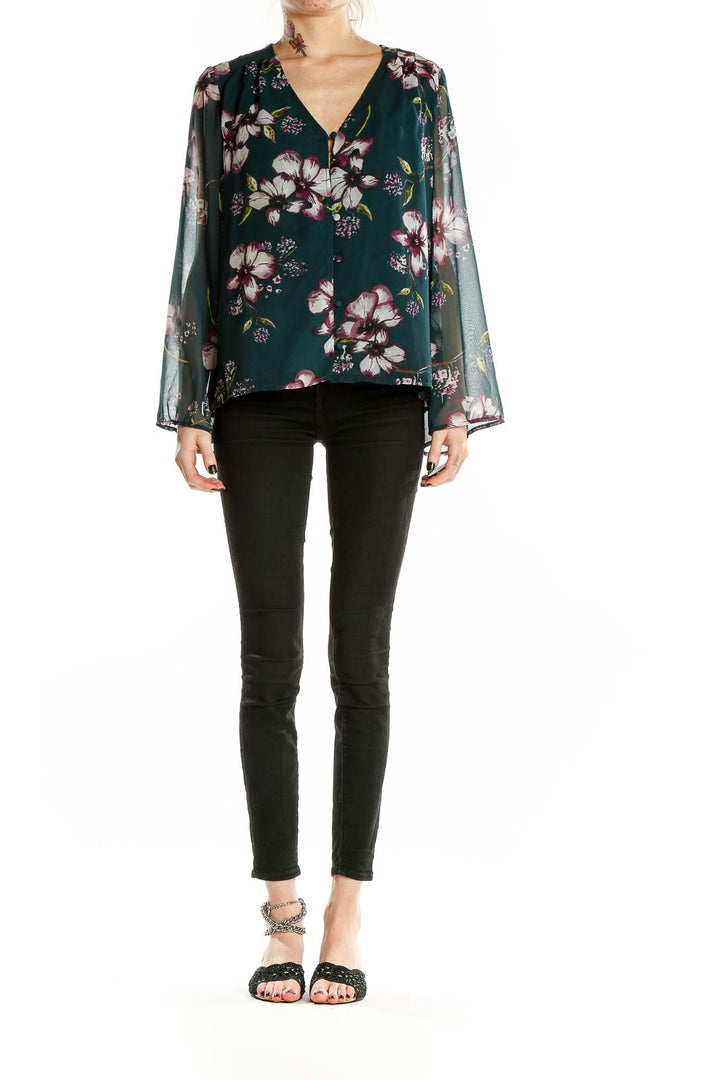 Front view of Cupcakes and Cashmere green floral blouse with V-neckline