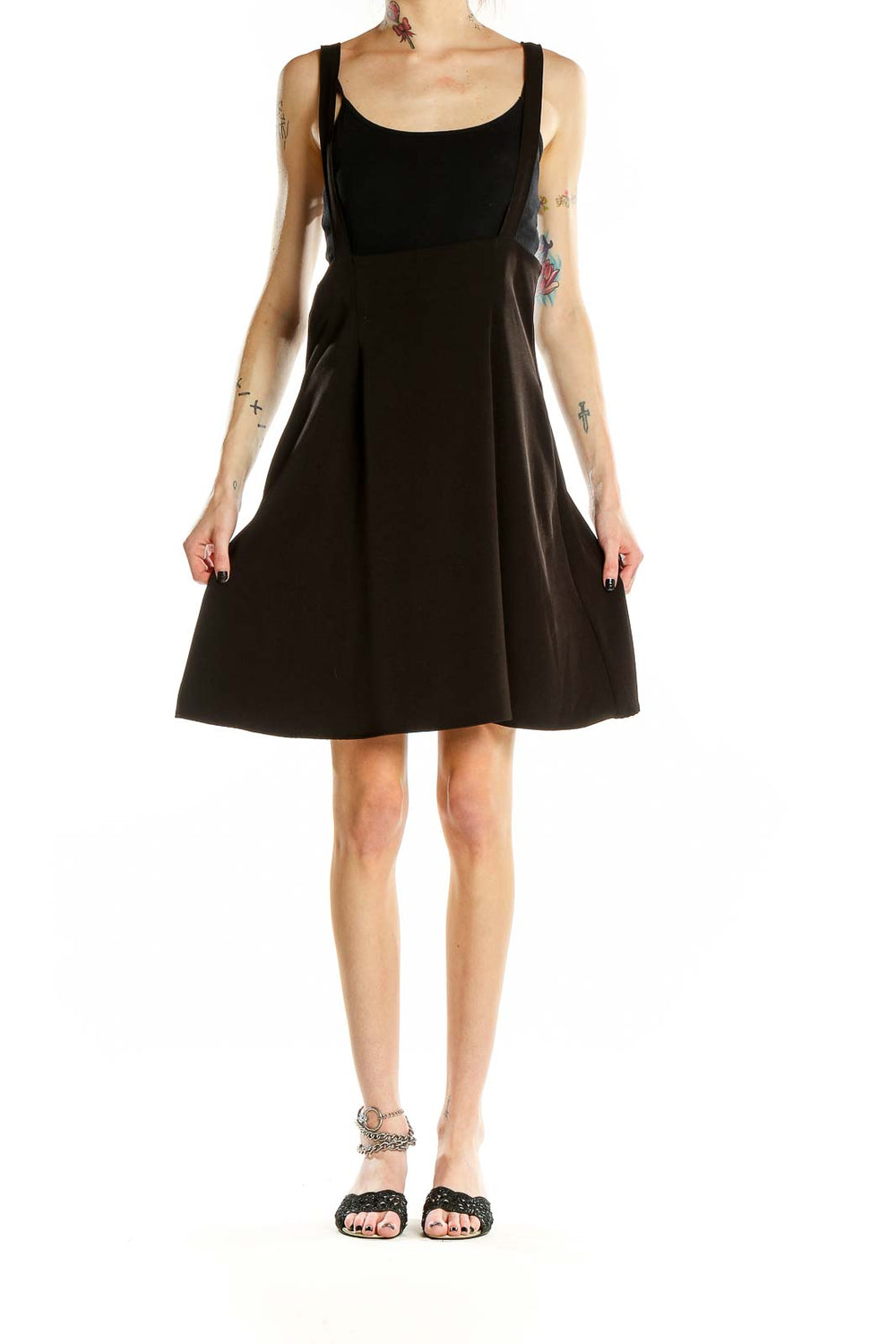 Front view of ModCloth black flared suspender skirt on model