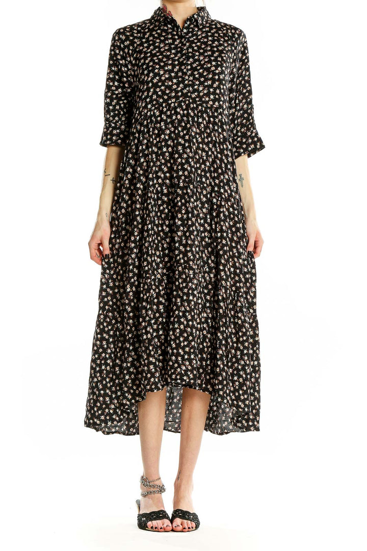 Front view of Natural Life black floral tiered maxi dress with button-down front