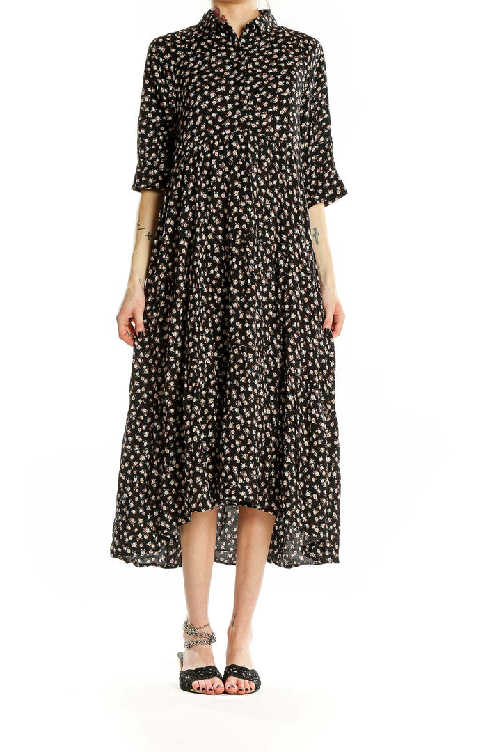 Front view of Natural Life black floral tiered maxi dress with button-down front