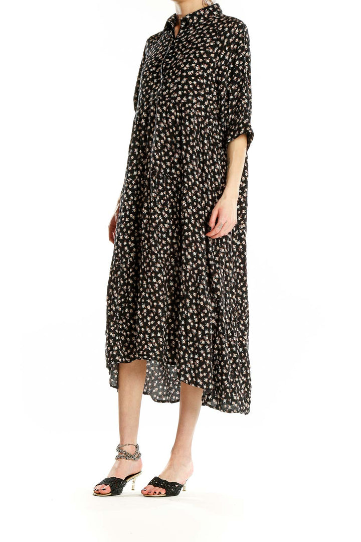 Front view of Natural Life black floral tiered maxi dress with button-down front