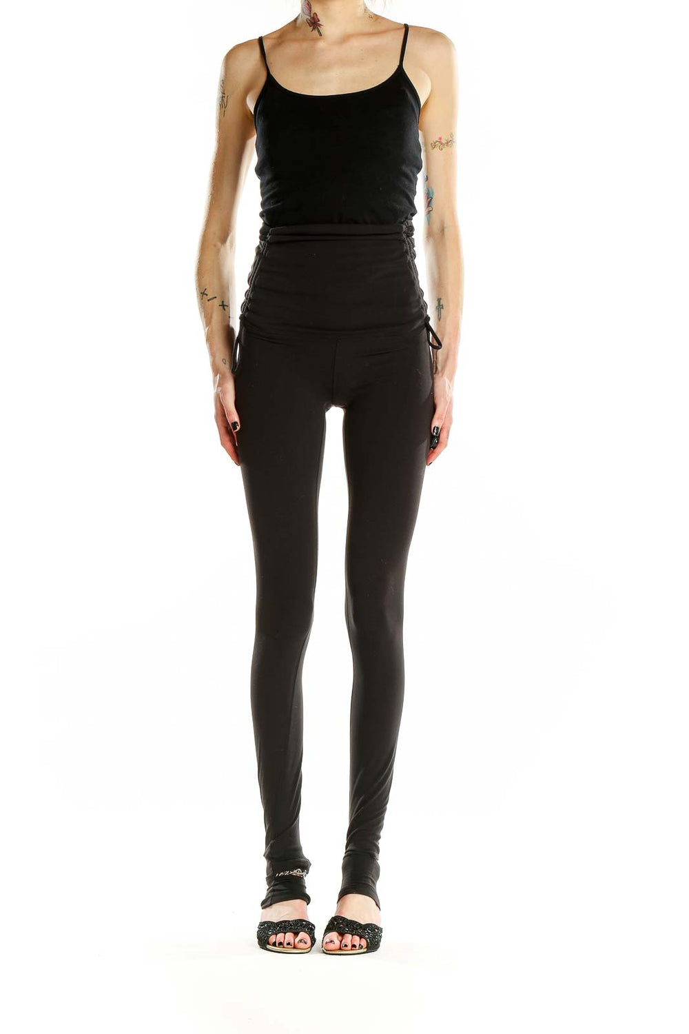 Front view of black Lululemon high-waisted yoga leggings with ruched sides