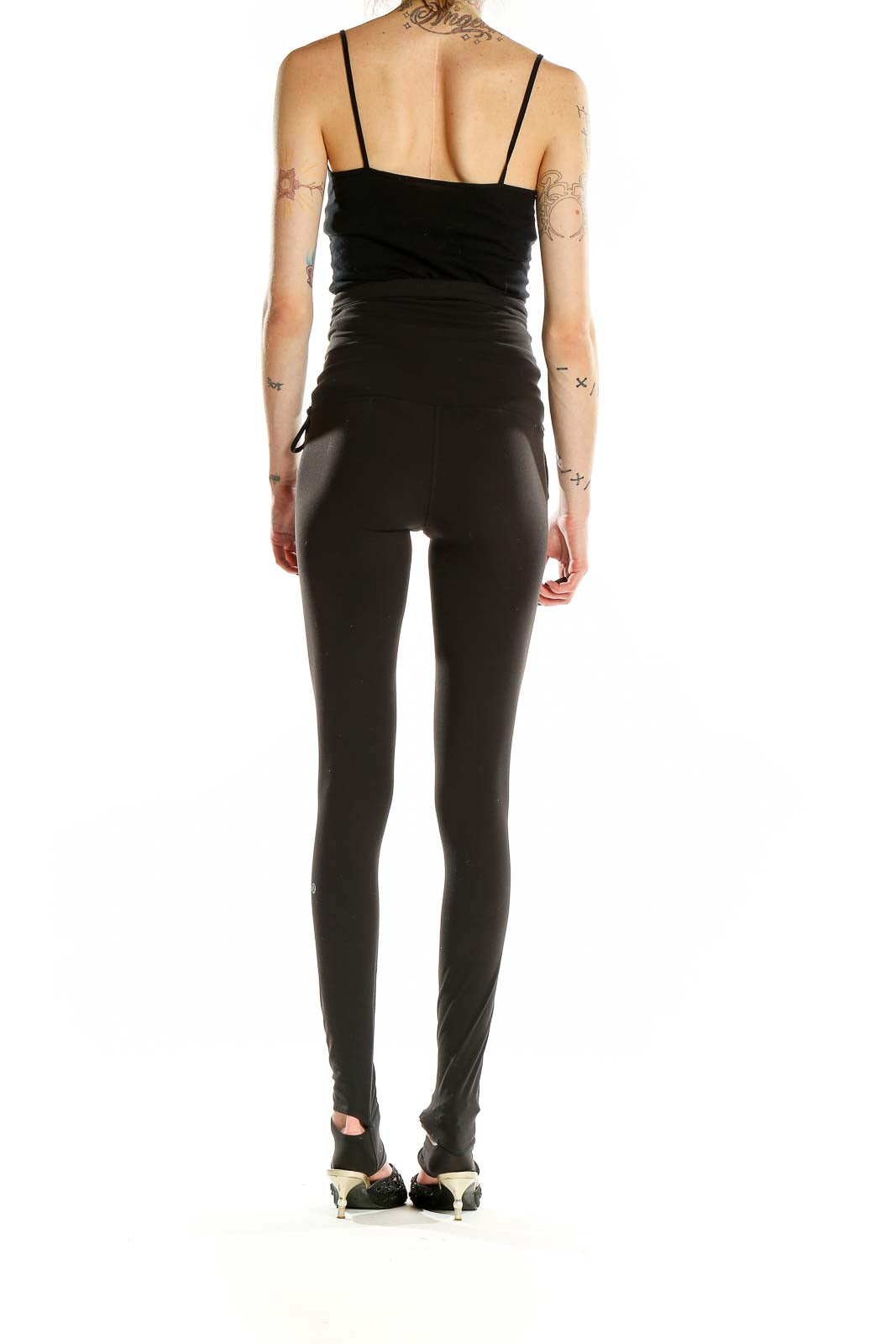 Back view of black Lululemon high-waisted yoga leggings showing full-length design