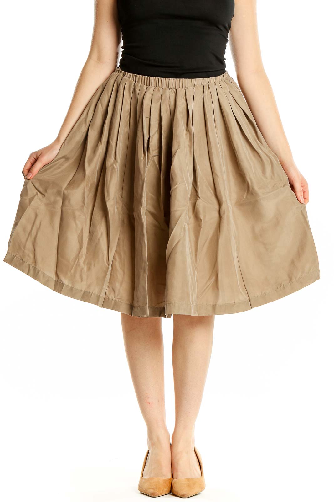 Front view of Pell & Co. beige silk pleated midi skirt on model