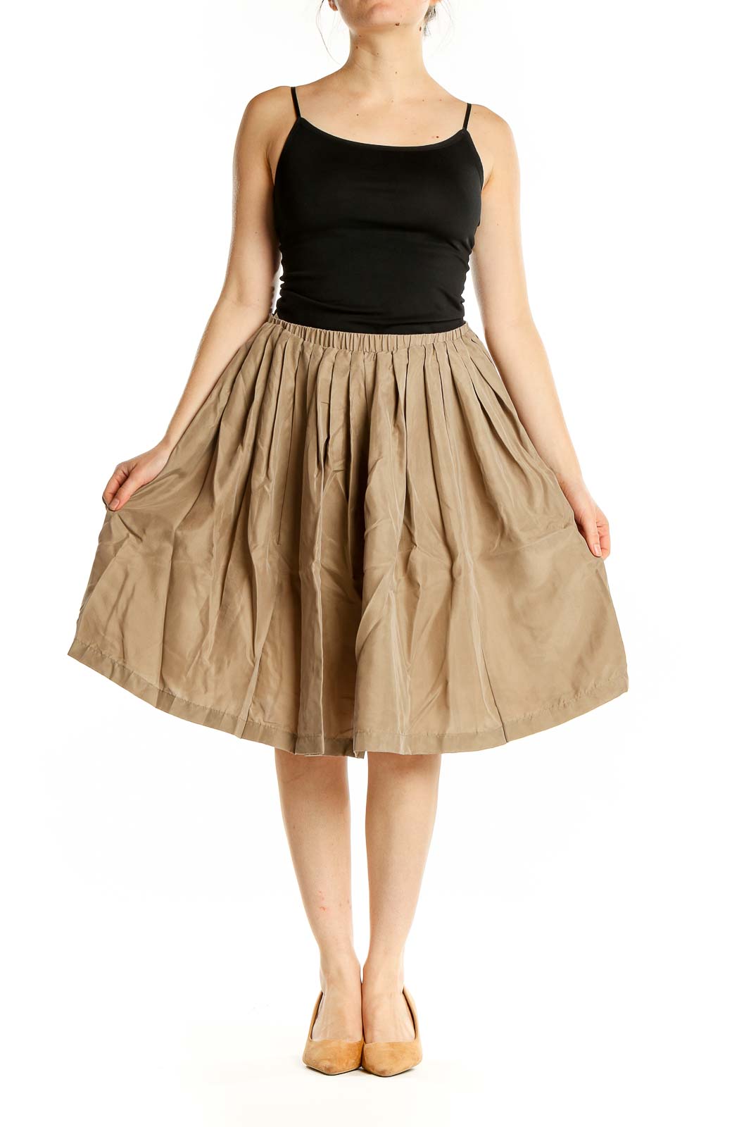 Front view of Pell & Co. beige silk pleated midi skirt on model