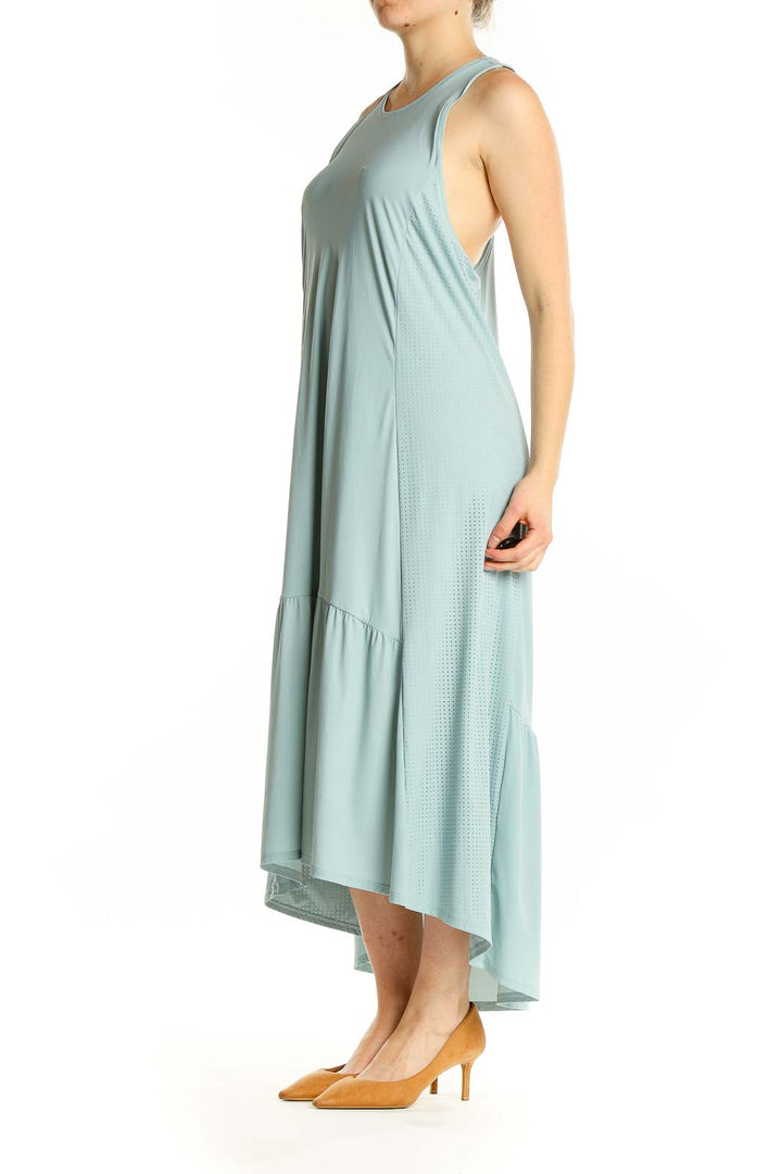 Front view of Sweaty Betty mint green flowy maxi dress with high-low hemline