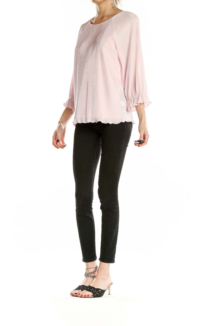 Front view of 1. State pink pleated blouse with raglan sleeves