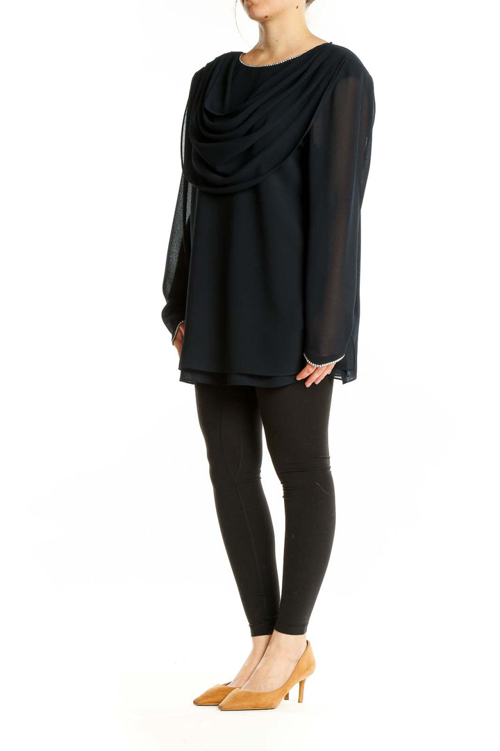 Front view of black Julian Wilder blouse with draped neckline and rhinestone details