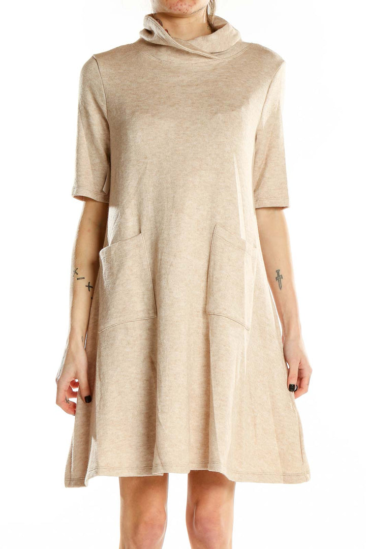 Front view of beige turtleneck swing dress with pockets