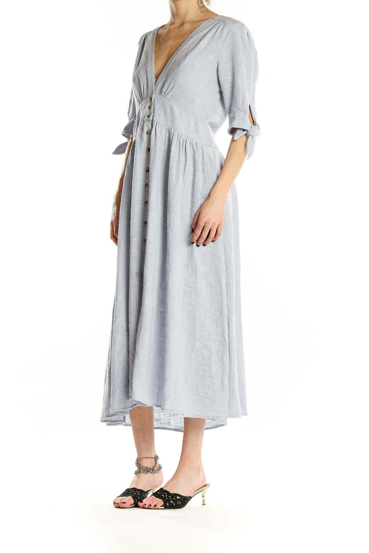 Front view of light blue Free People button-front midi dress with tie sleeves