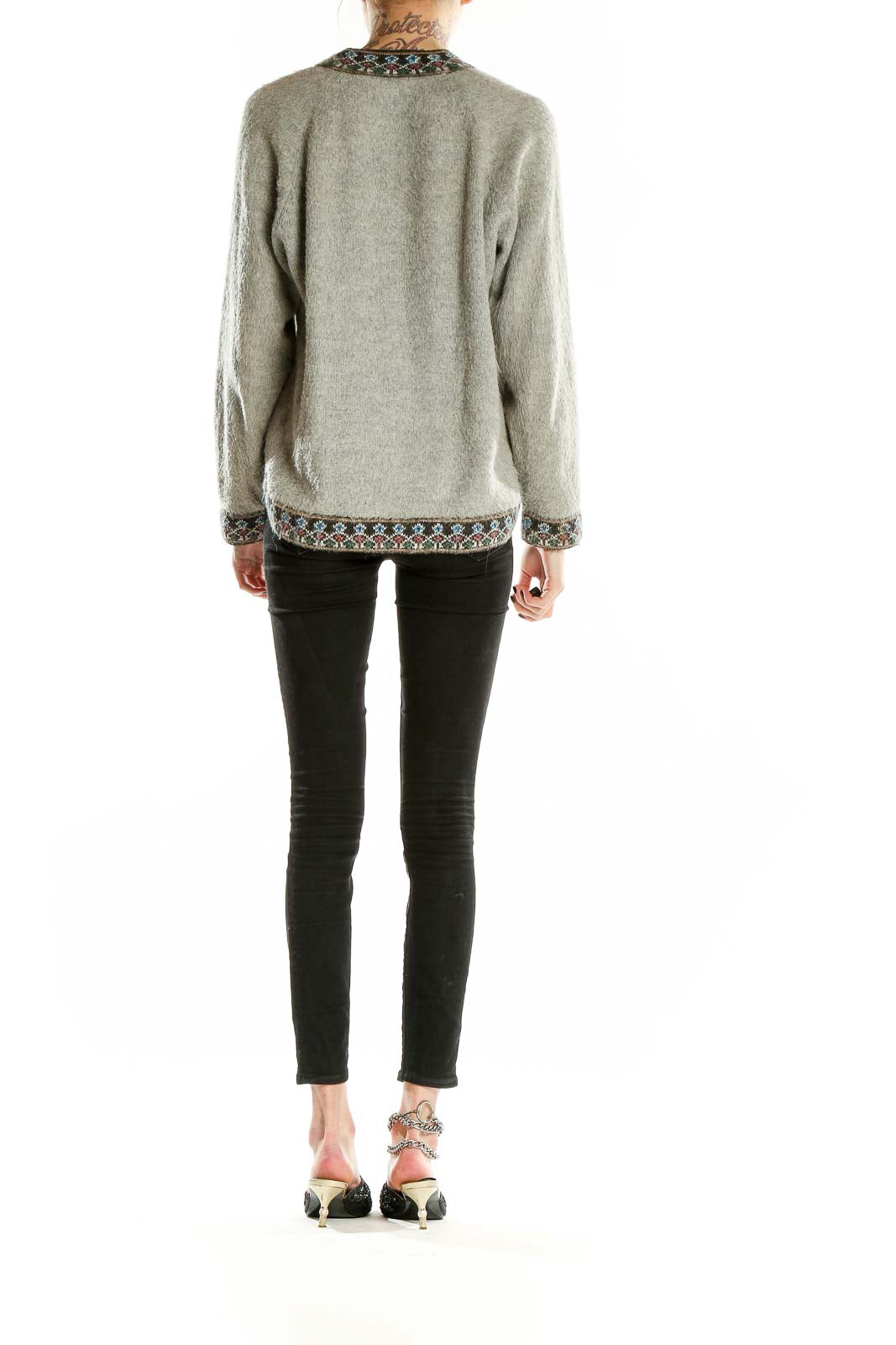 Back view of gray SilkRoll knit sweater showing embroidered hem detail