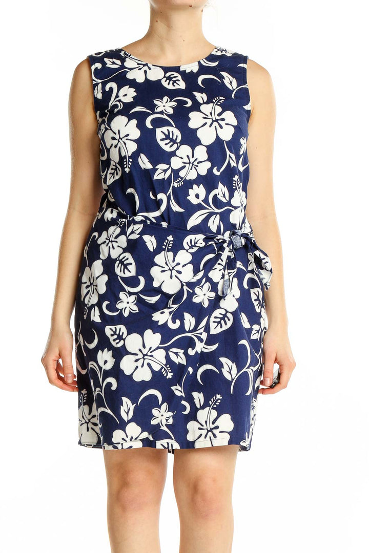 Front view of Shannon Marie navy and white floral print sleeveless cotton dress with side tie