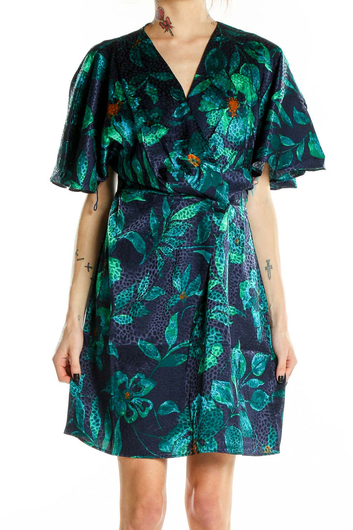 Front view of London Times green floral wrap dress with flutter sleeves