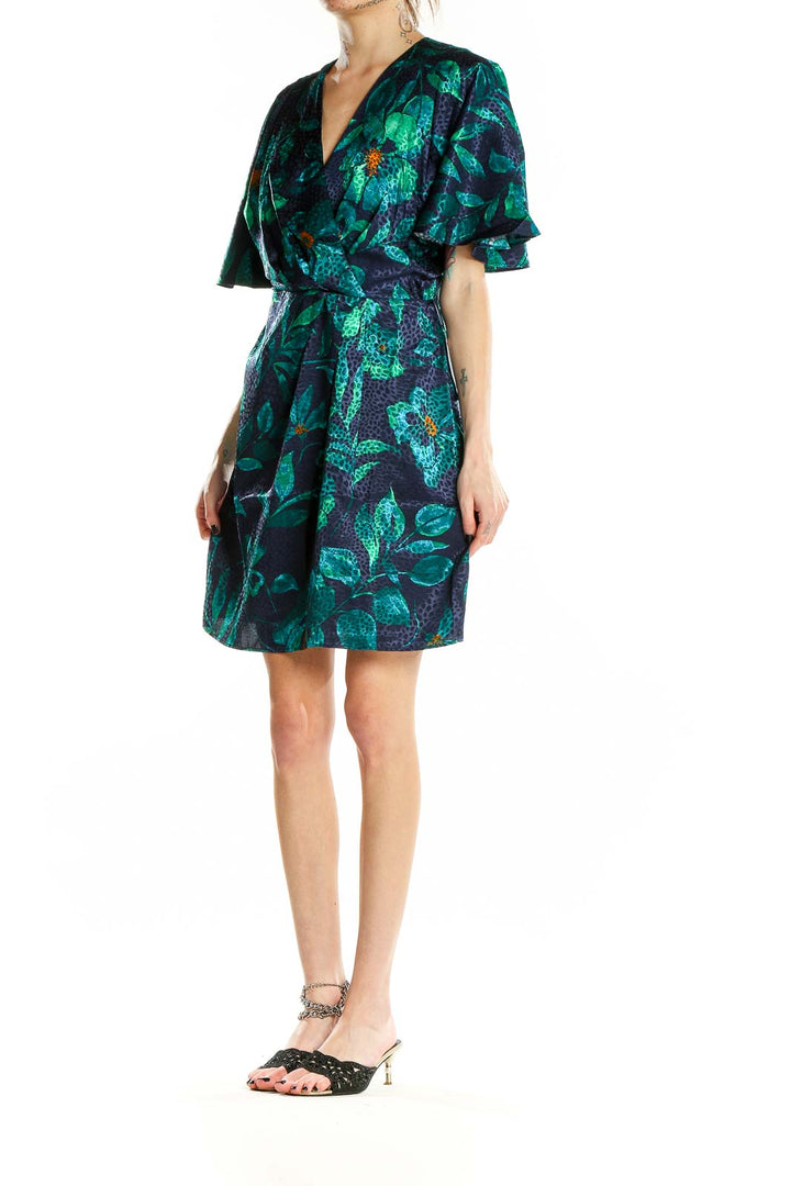 Front view of London Times green floral wrap dress with flutter sleeves