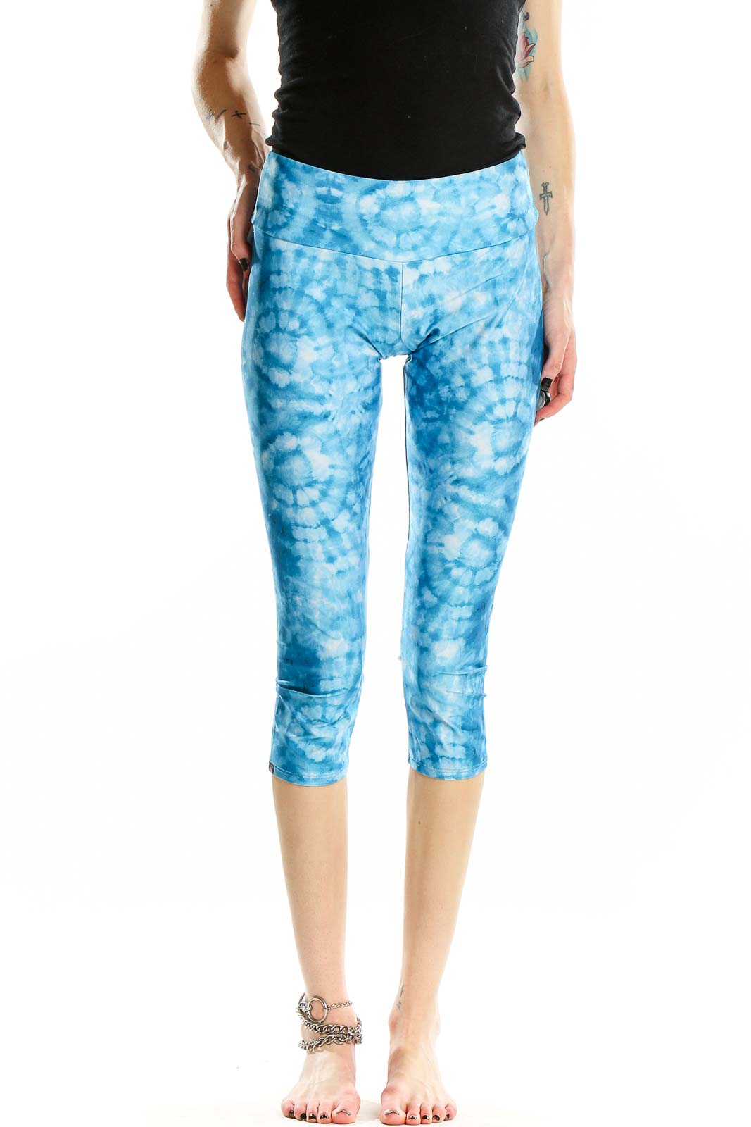 Front view of Onzie blue tie-dye capri yoga leggings on model