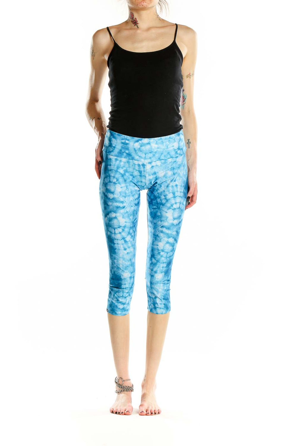 Front view of Onzie blue tie-dye capri yoga leggings on model