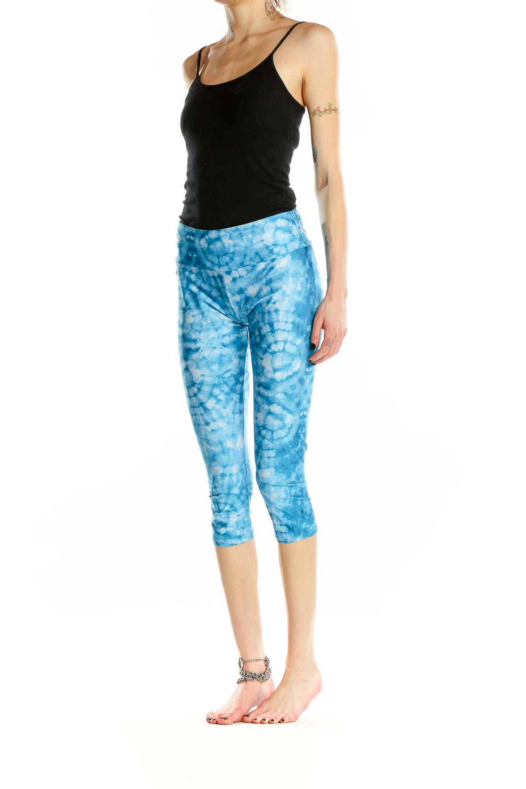 Front view of Onzie blue tie-dye capri yoga leggings on model