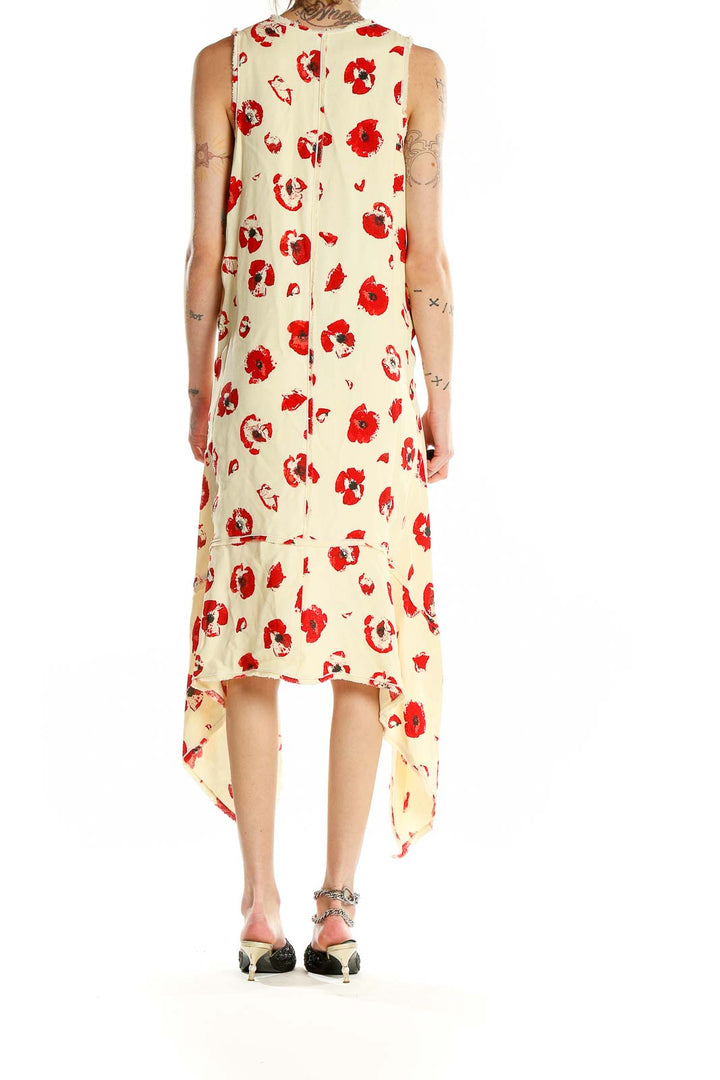 Back view of Proenza Schouler cream sleeveless dress showing floral print and high-low design