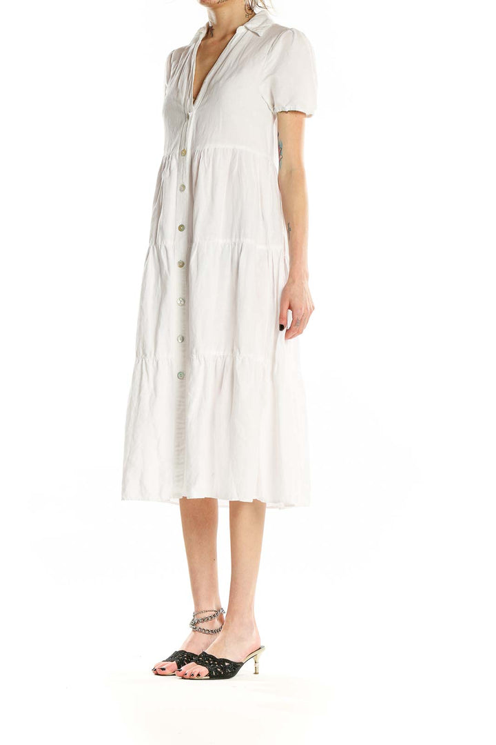 Front view of Zara white tiered cotton-linen midi dress with button-front and puff sleeves