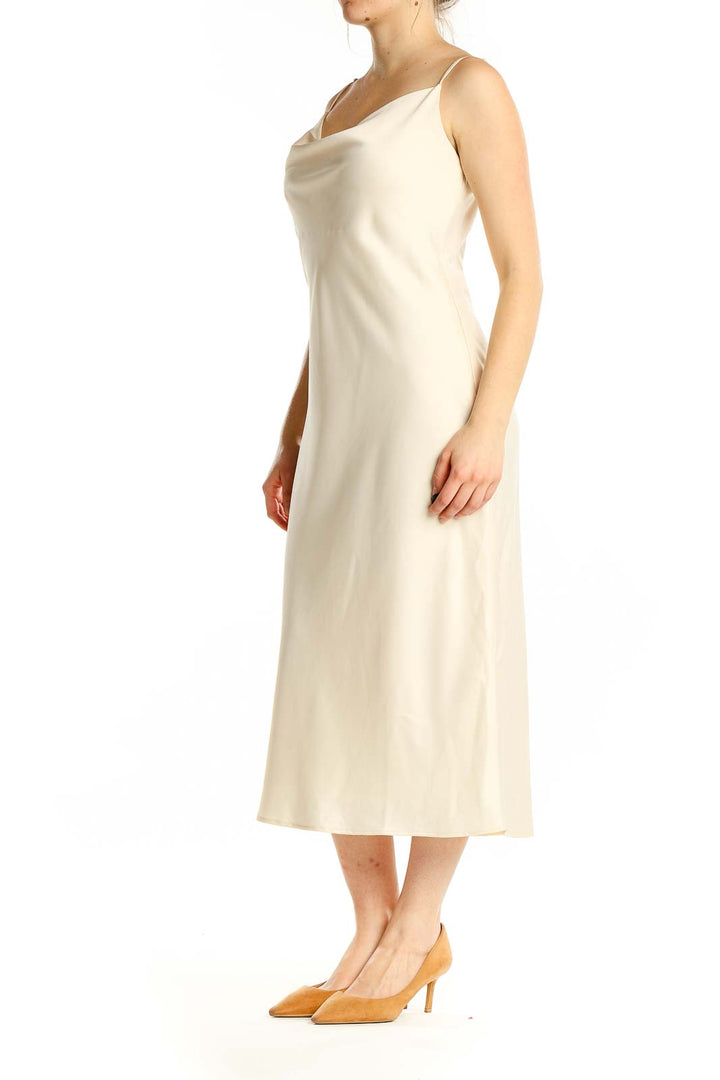 Front view of Birdy Grey cream satin slip midi dress with cowl neckline