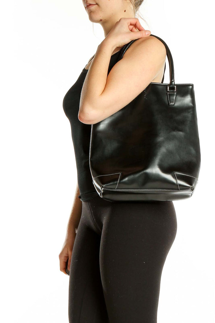 Front view of black vinyl XOXO structured tote bag