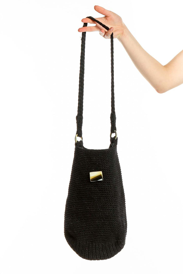 Front view of black knitted shoulder bag with long braided strap