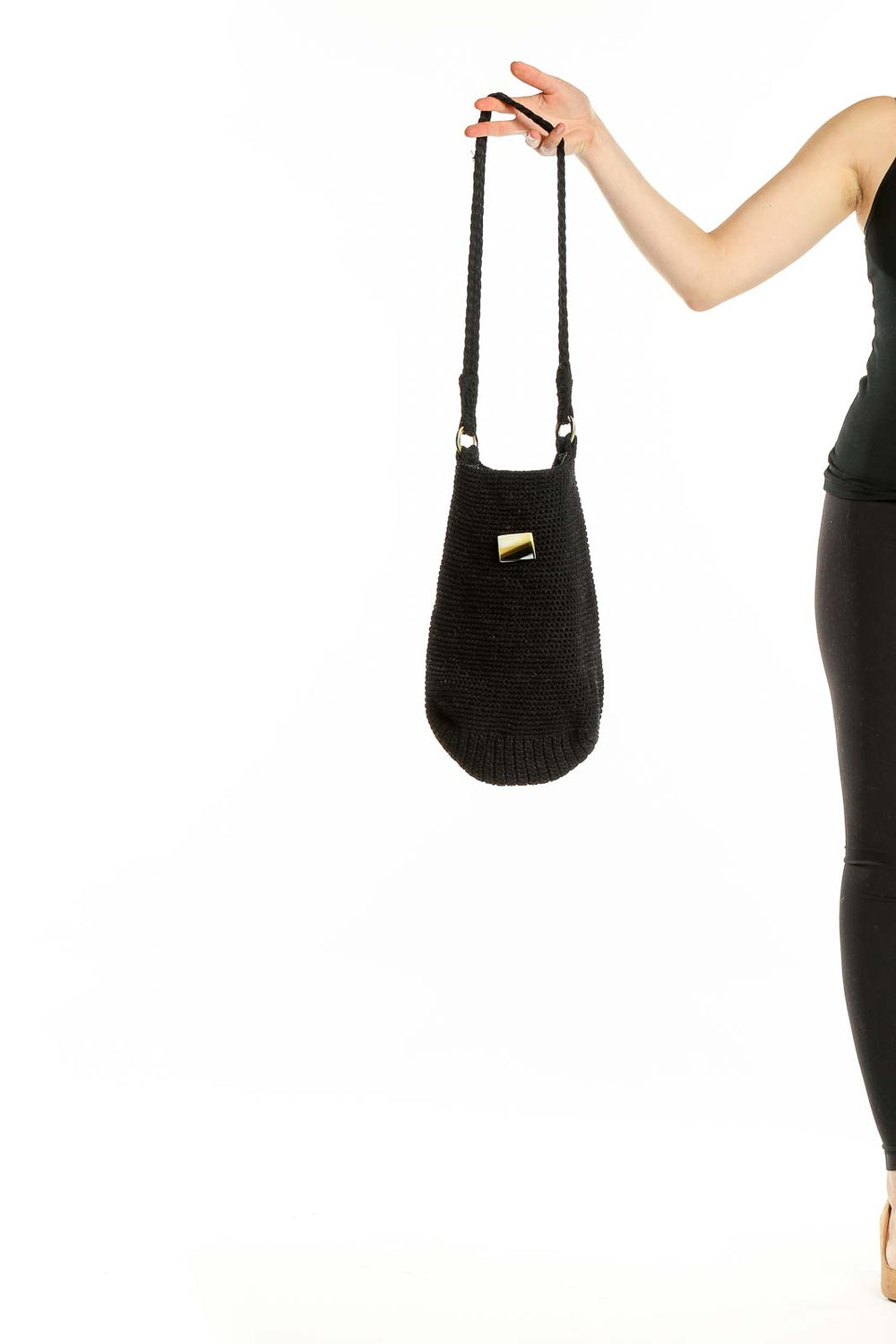 Front view of black knitted shoulder bag with long braided strap