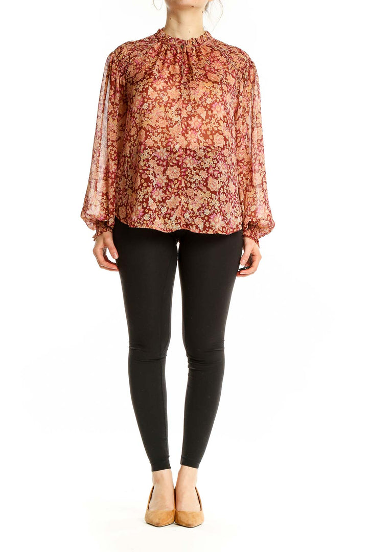 Front view of Joie burgundy floral print sheer blouse with high neckline