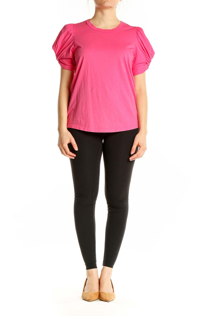 Front view of A.L.C. pink puff-sleeve cotton top on model